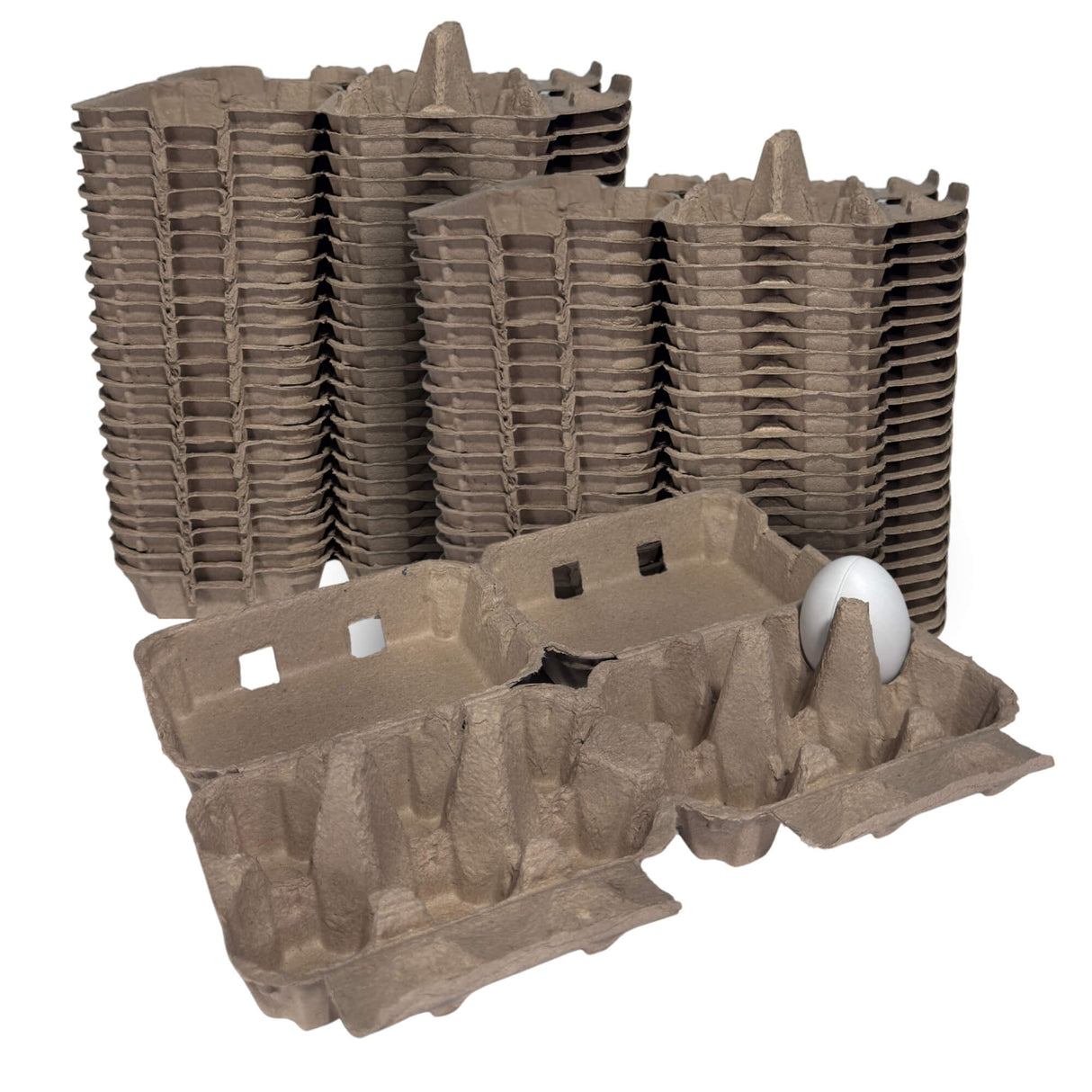 Stacks of brown cardboard egg crates with a single white egg on a white background