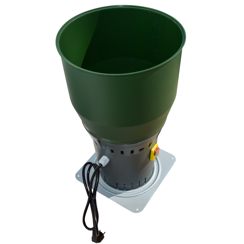 Angled top view of Farm Mill Compact Feed Crusher showing large green hopper, gray motor base with ventilation slots, and power cord with safety switch