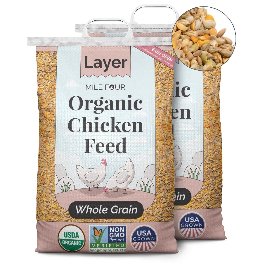 two bags of Mile Four Layer Organic Chicken Feed whole grain