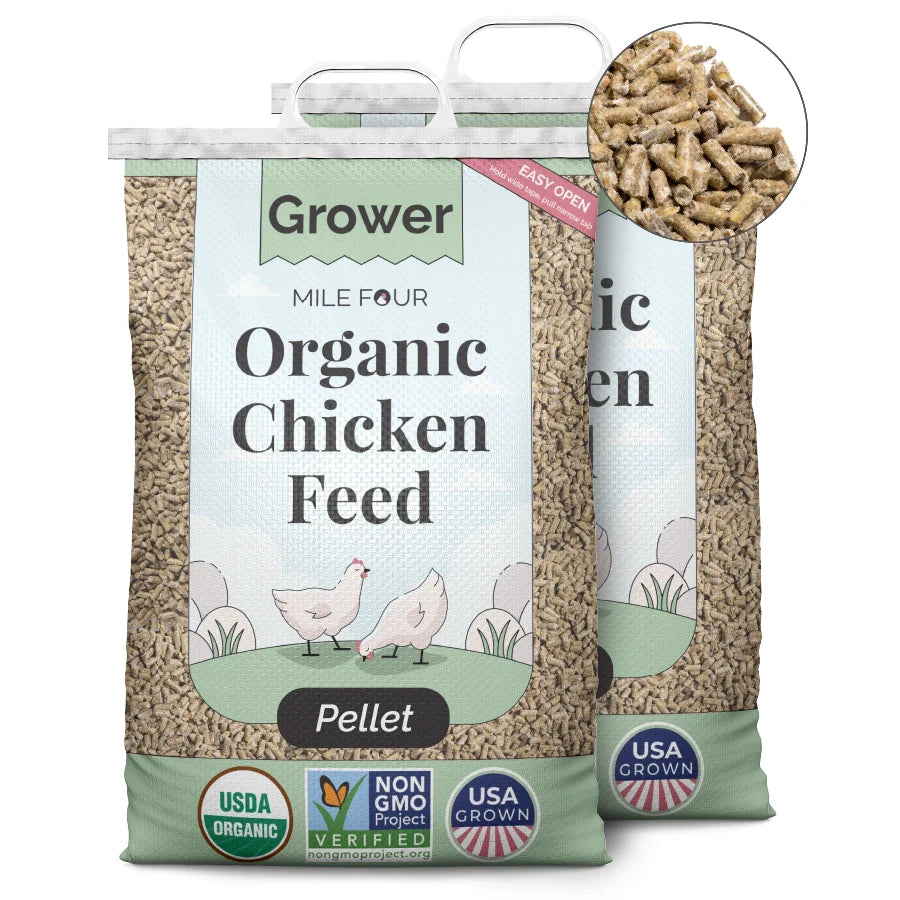 two large bags of Mile Four Organic Chicken Grower Feed pellets