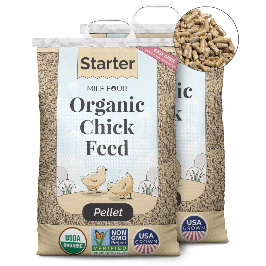 two large bags of Mile Four Starter Organic Chicken Feed pellet