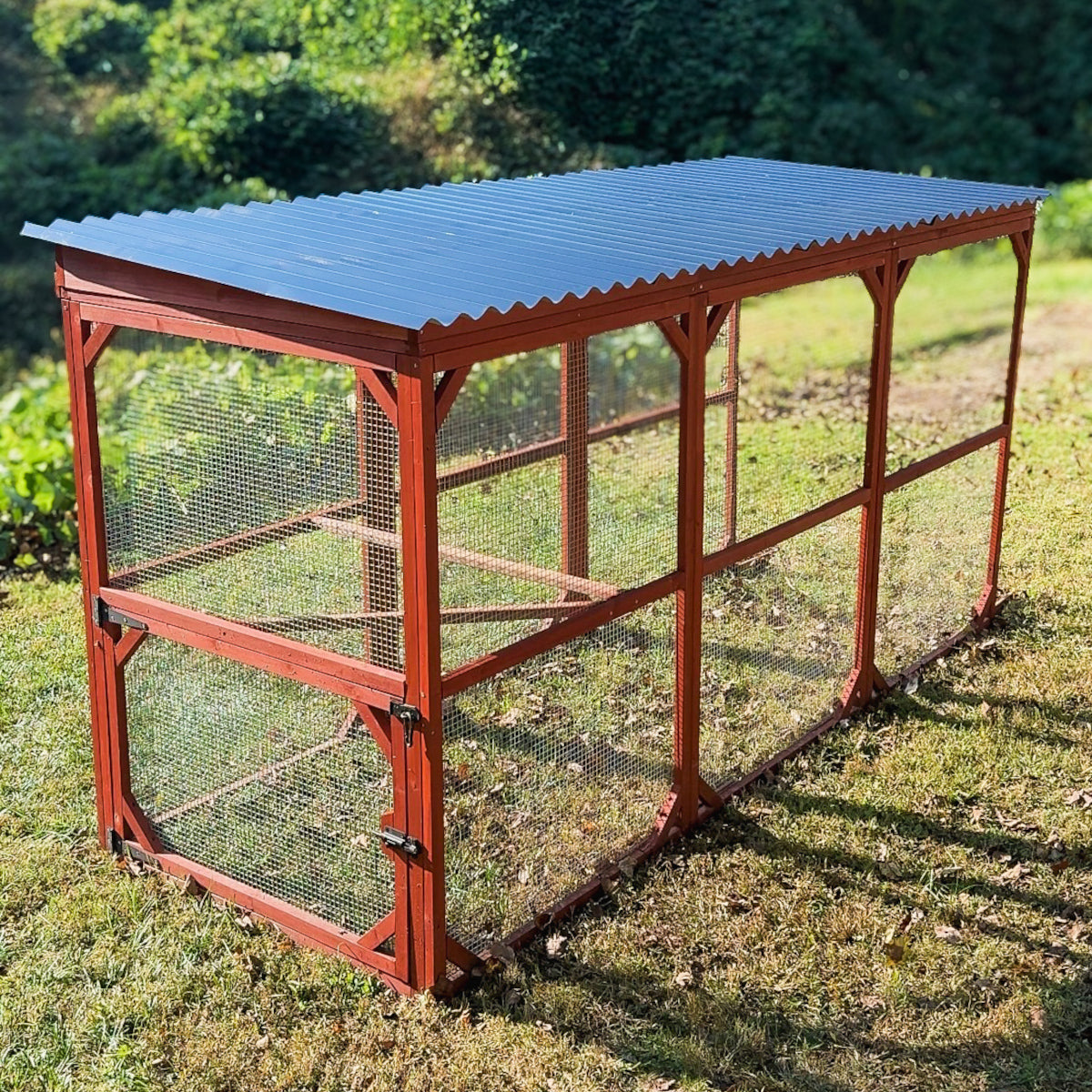 Chicken coop run extension roof attached to a backyard poultry run
