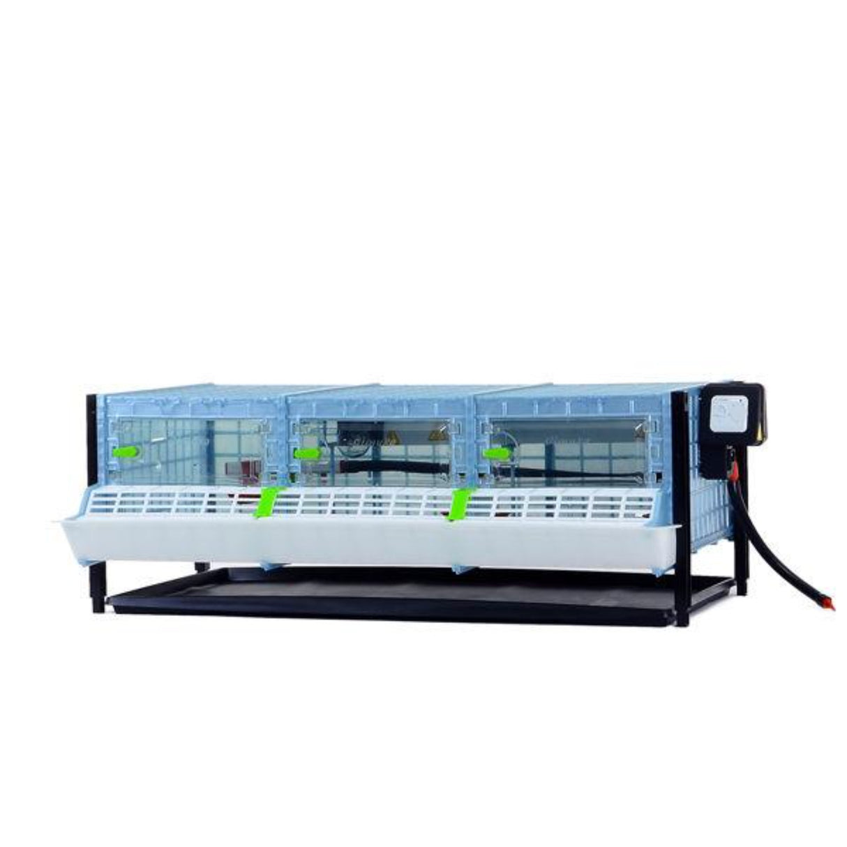 Hatching Time Cimuka Layer addition for brooder system shown. Plastic clear doors are closed. Feeding trough can be seen on front of brooder. Temperature thermostat can be seen on side of brooder.