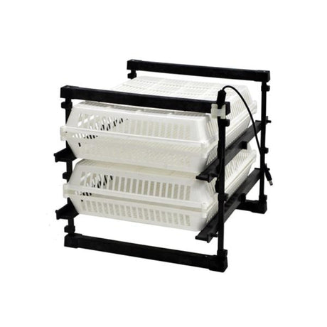 Hatching Time Cimuka. 60-set hatcher can be seen in image with 2 egg racks for securing newly-hatched chicks.  Hatching baskets are on rack to secure them.