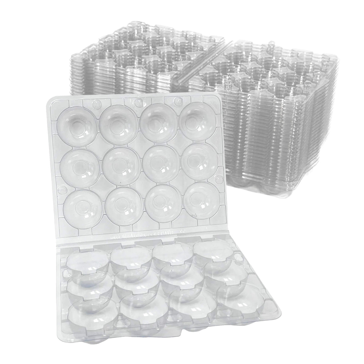 Clear plastic egg cartons stacked on a white background