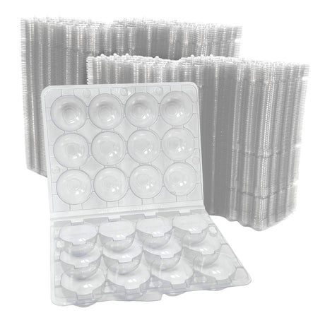 Clear plastic egg trays with a white background