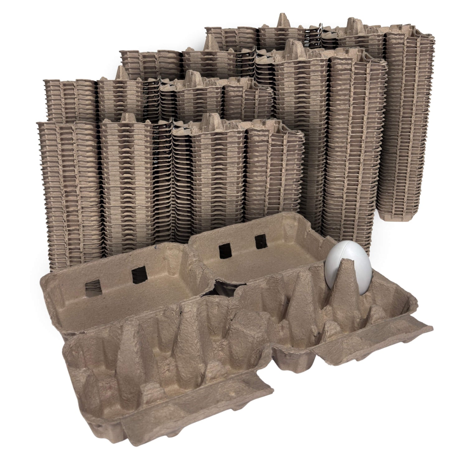 Stack of brown cardboard egg crates with a single white egg on a white background