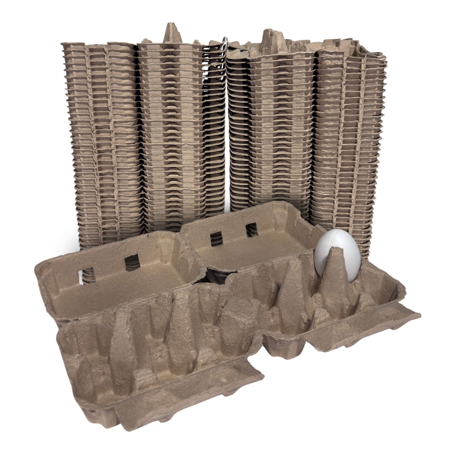 Stacks of brown cardboard egg cartons with a single white egg on a white background