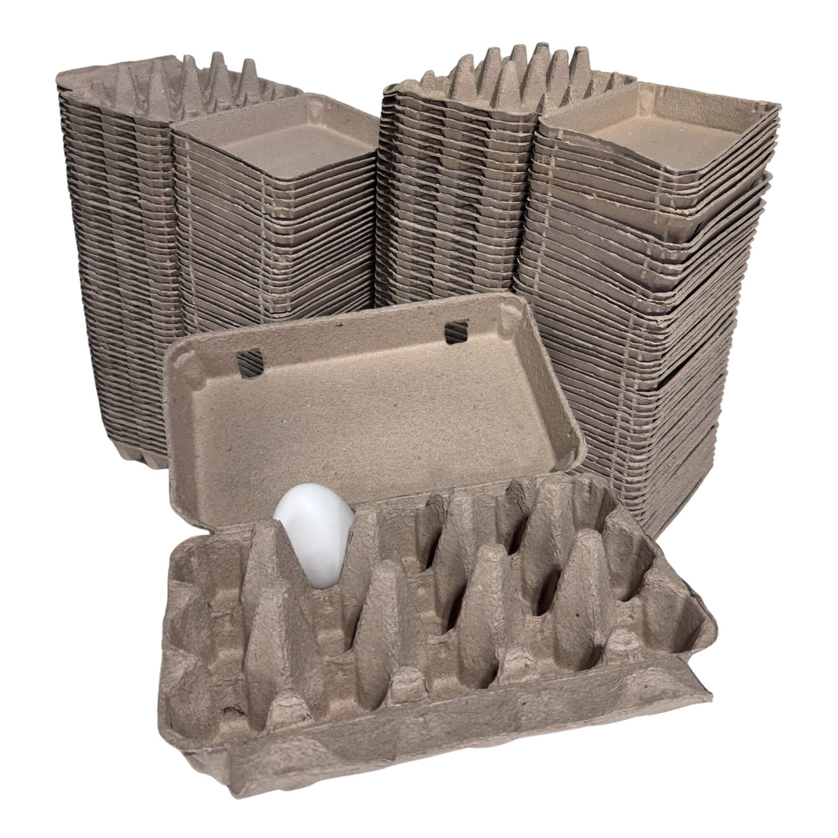 Stacks of cardboard egg trays with a single egg on a white background