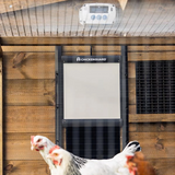 Hatching Time. ChickenGuard Pro with Self-Locking Door Kit shown installed on coop.