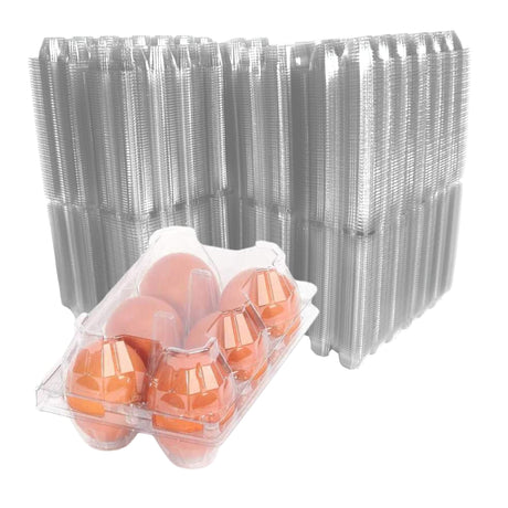 Carton of eggs with a stack of clear plastic egg trays on a white background