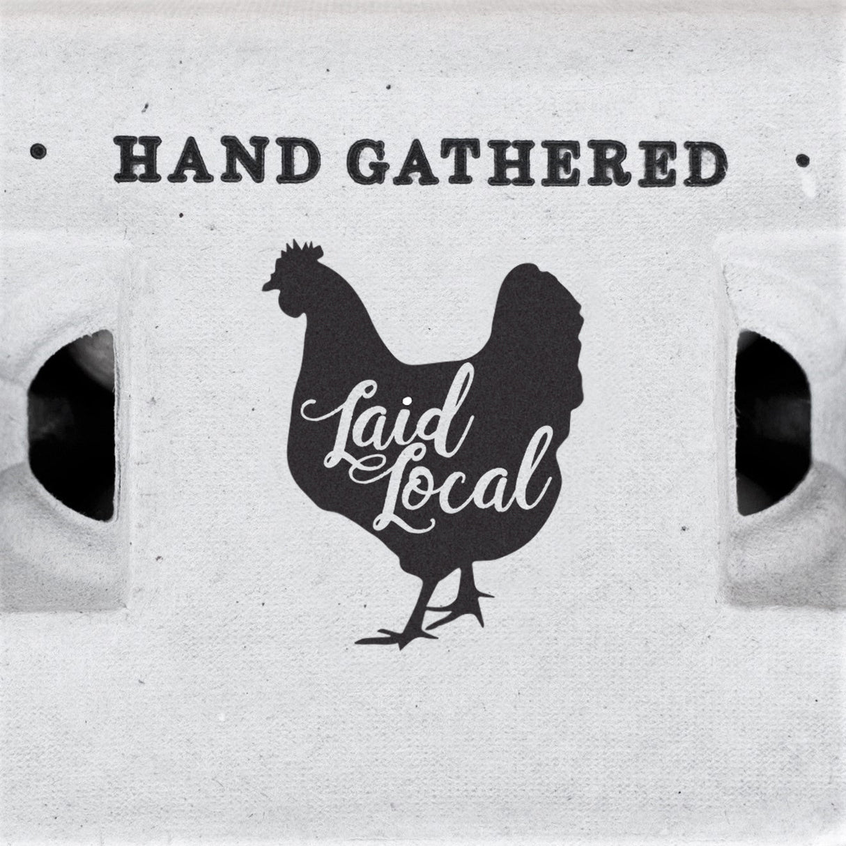 Image shows a chicken with text reading "Hand Gathered Laid Local"