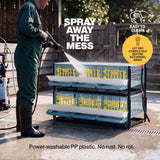 Person power washing a Cimuka by Hatching Time double layer quail cage addition, with instructions to dry before returning birds