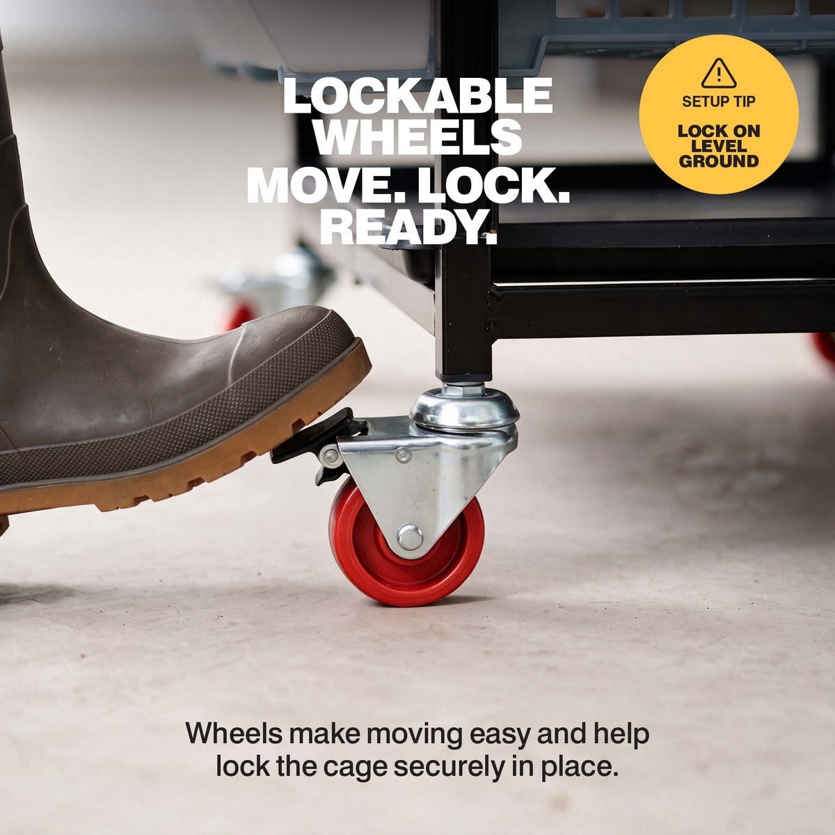 Foot pressing the lock on a red caster wheel attached to the quail breeding cage stand
