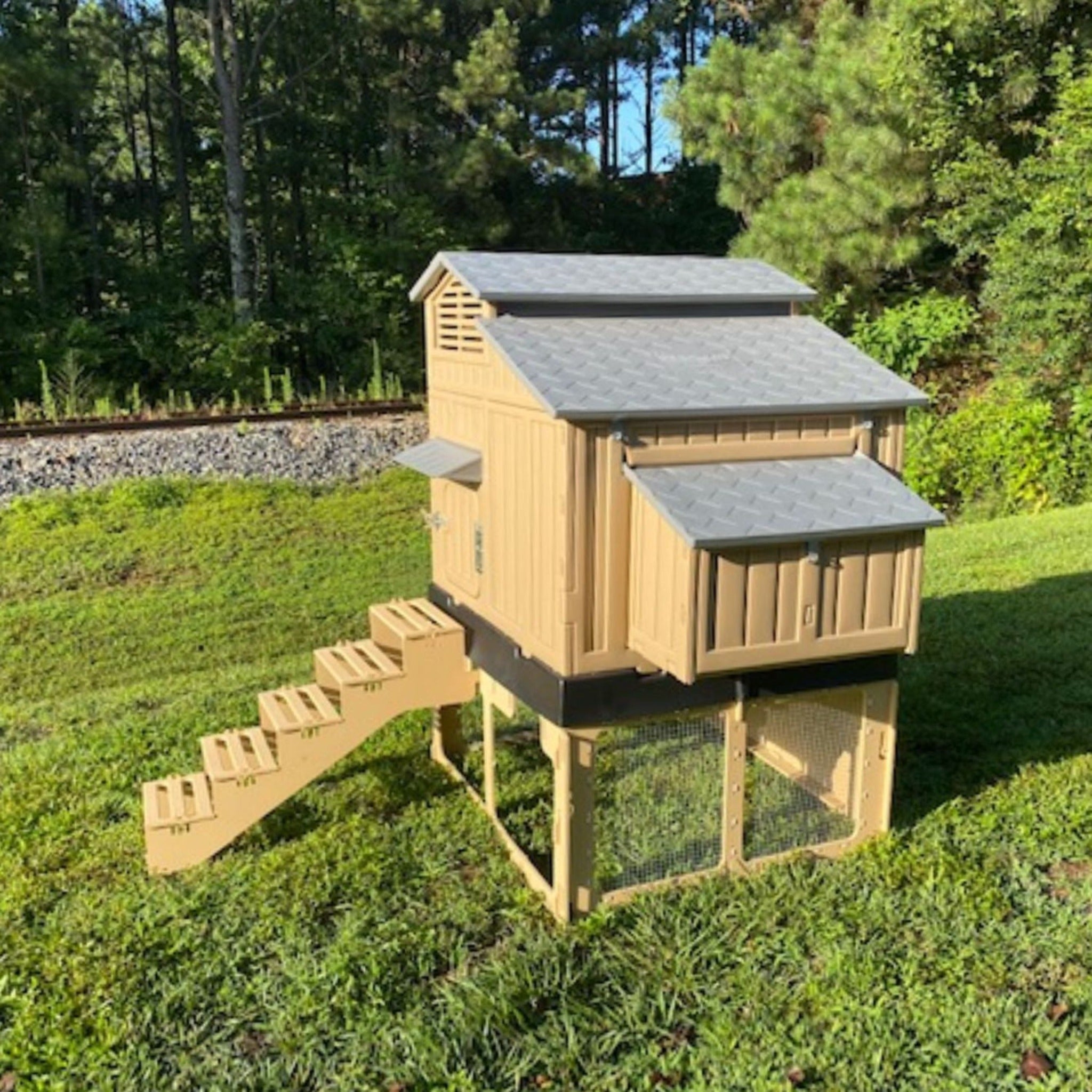 Stand and stairs for Formex Standard and Large chicken coop. Image showing assembled coop stand and stairs under Large Chicken Coop. Side View