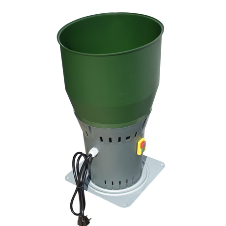 Angled top view of Farm Mill Compact Feed Crusher with green hopper and gray motor base, showing power cord and control switch for grain milling