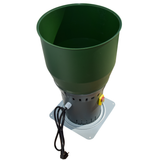 Angled top view of Farm Mill Compact Feed Crusher showing large green hopper, gray motor base with ventilation slots, and power cord with safety switch