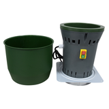 Farm Mill Compact Feed Crusher disassembled showing green hopper removed from gray motor base with safety power switch and attached power cord