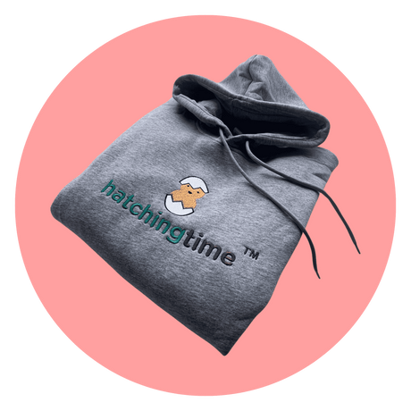 Hatching Time. A hatching time hoodie can be seen in in image with Hatching Time logo.