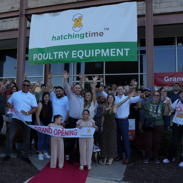 Hatching Time. Grand opening image showing Team Members in front of New location with Grand opening banner.