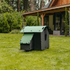 Hatching Time Nestera. Small coop can be seen in image on grass. Nesting box is on side connected to chicken coop, with lifting door for easy egg access. Roof of coop is slanted to prevent roosting.