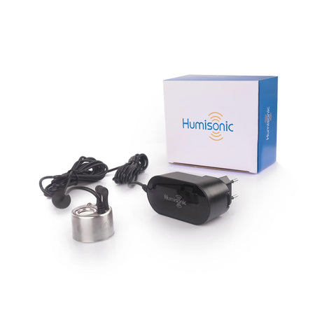 Humisonic electronic device with power adapter and packaging on a white background