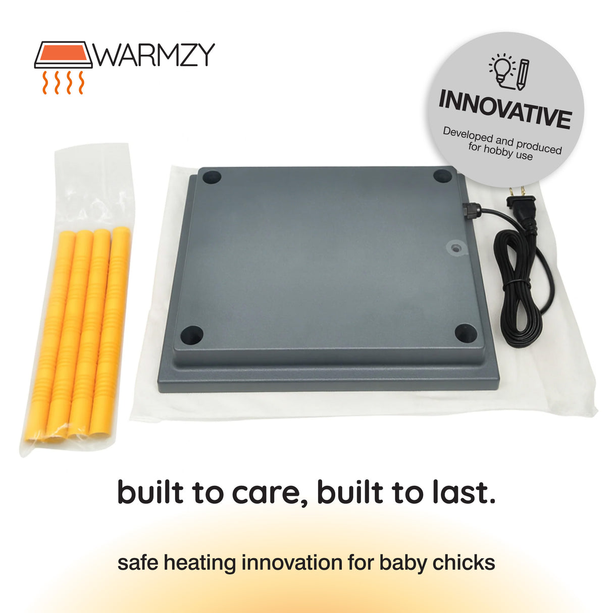 Gray heating pad with yellow sticks and power cable, branded 'Warmzy'.