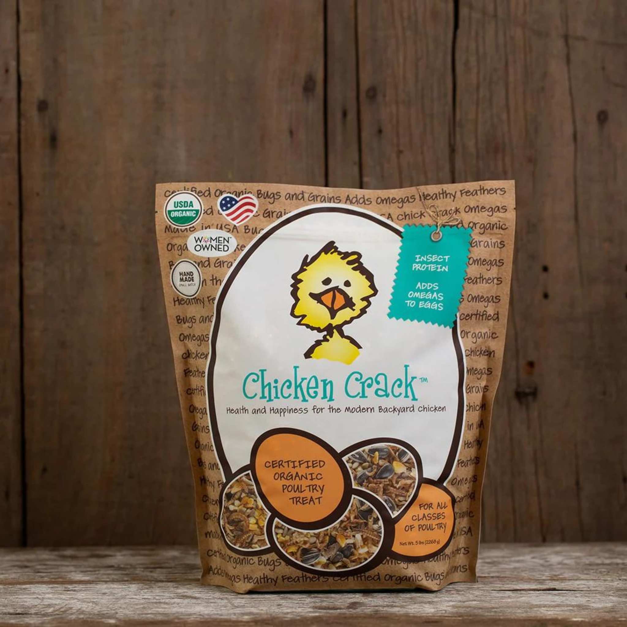 Hatching Time Treats for Chickens. Chicken Crack bag can be seen on wooden table. Bag shows treats contain insect protein and adds omegas to eggs. Certified organic poultry treat. Good for all classes of poultry.