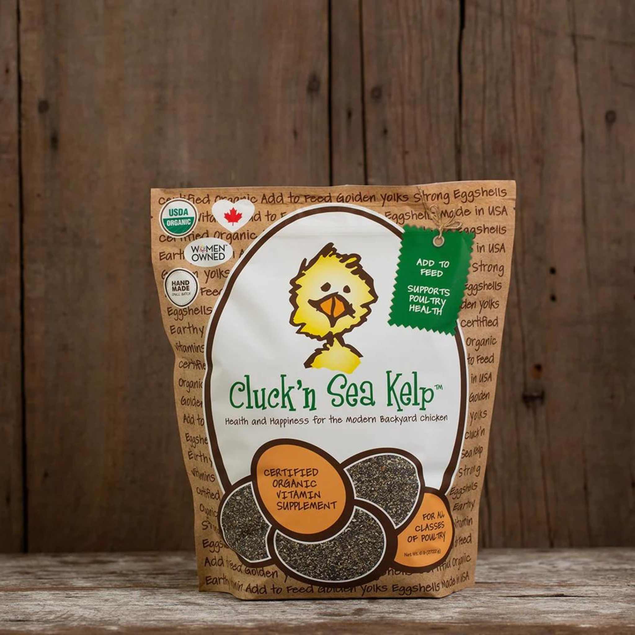 Hatching Time Treats for Chickens. Cluck'n Sea Kelp can be seen on wooden table. Bag shows certified organic vitamin supplement for chickens. Rated for all classes of poultry. Made to support poultry health.