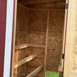 Hatching Time OverEZ interior view of Chicken coop. 3 roosts can be seen inside of chicken coop made of pine.