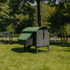 Hatching Time Nestera. Rear View of Medium Lodge coop can be seen in image on grass. Nesting box is on side connected to chicken coop, with lifting door for easy egg access. Roof of coop is slanted to prevent roosting.