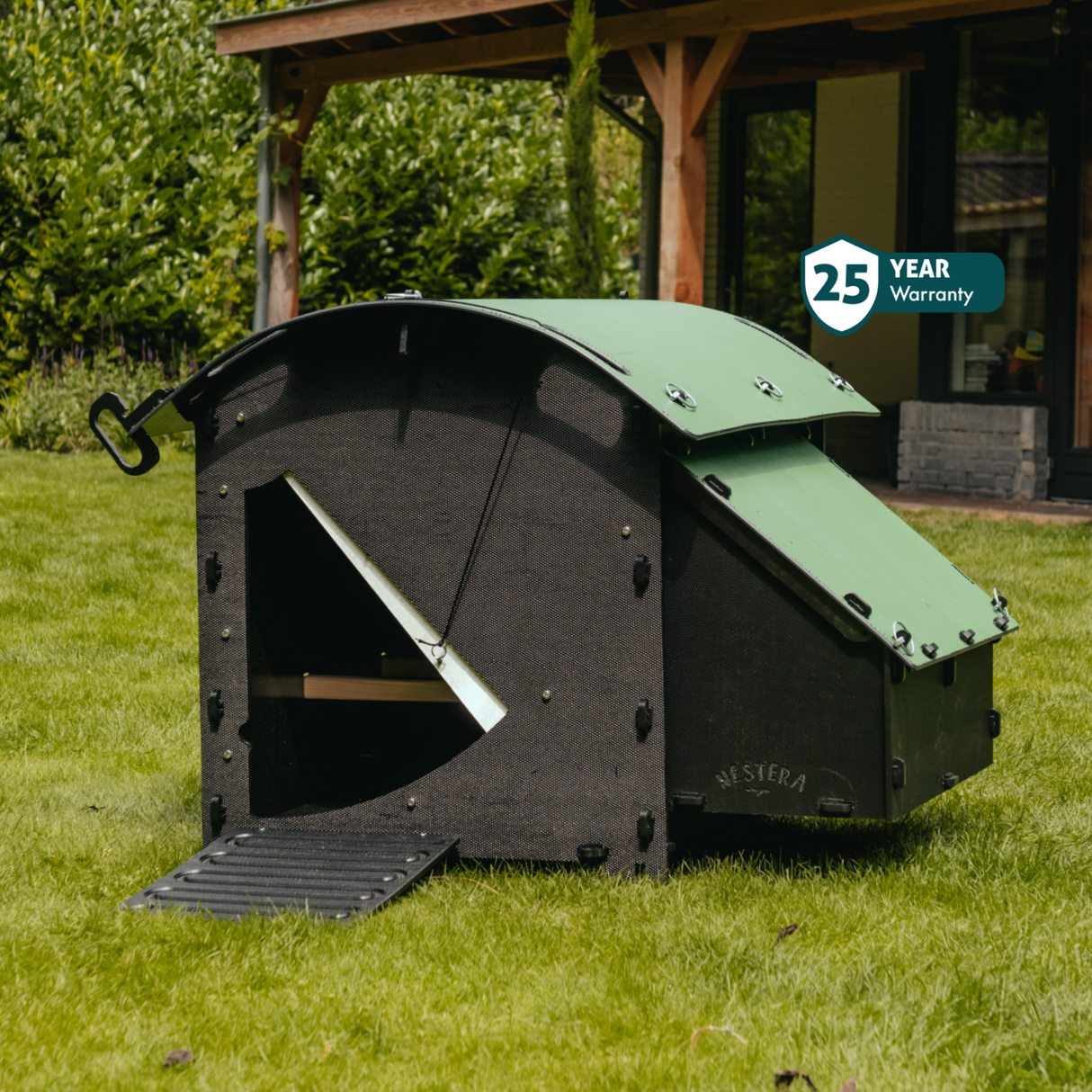 Hatching Time Nestera. Medium house chicken coop can be seen on grass. Ramp can be seen leading to coop door. Nesting box can be seen on die of coop.