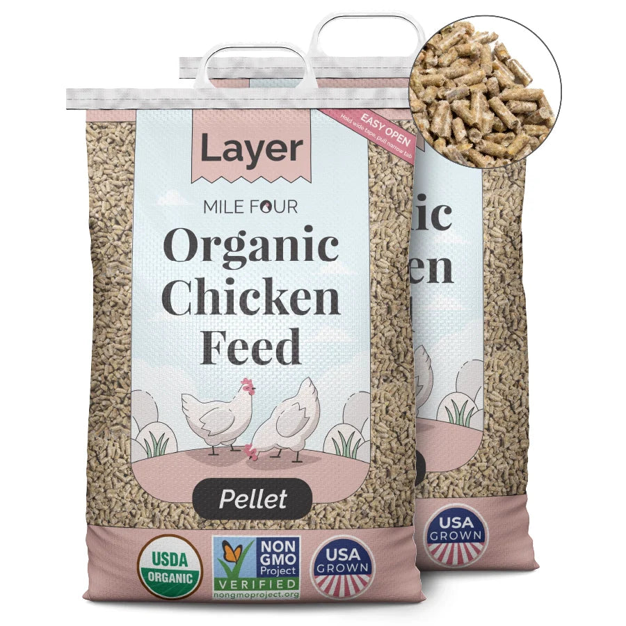 two large bags of Mile Four Layer Organic Chicken Feed pellets