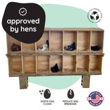 Wooden chicken coop with chickens inside, labeled 'approved by hens' and 'made in USA'.