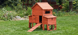 Red wooden chicken coop with attached run