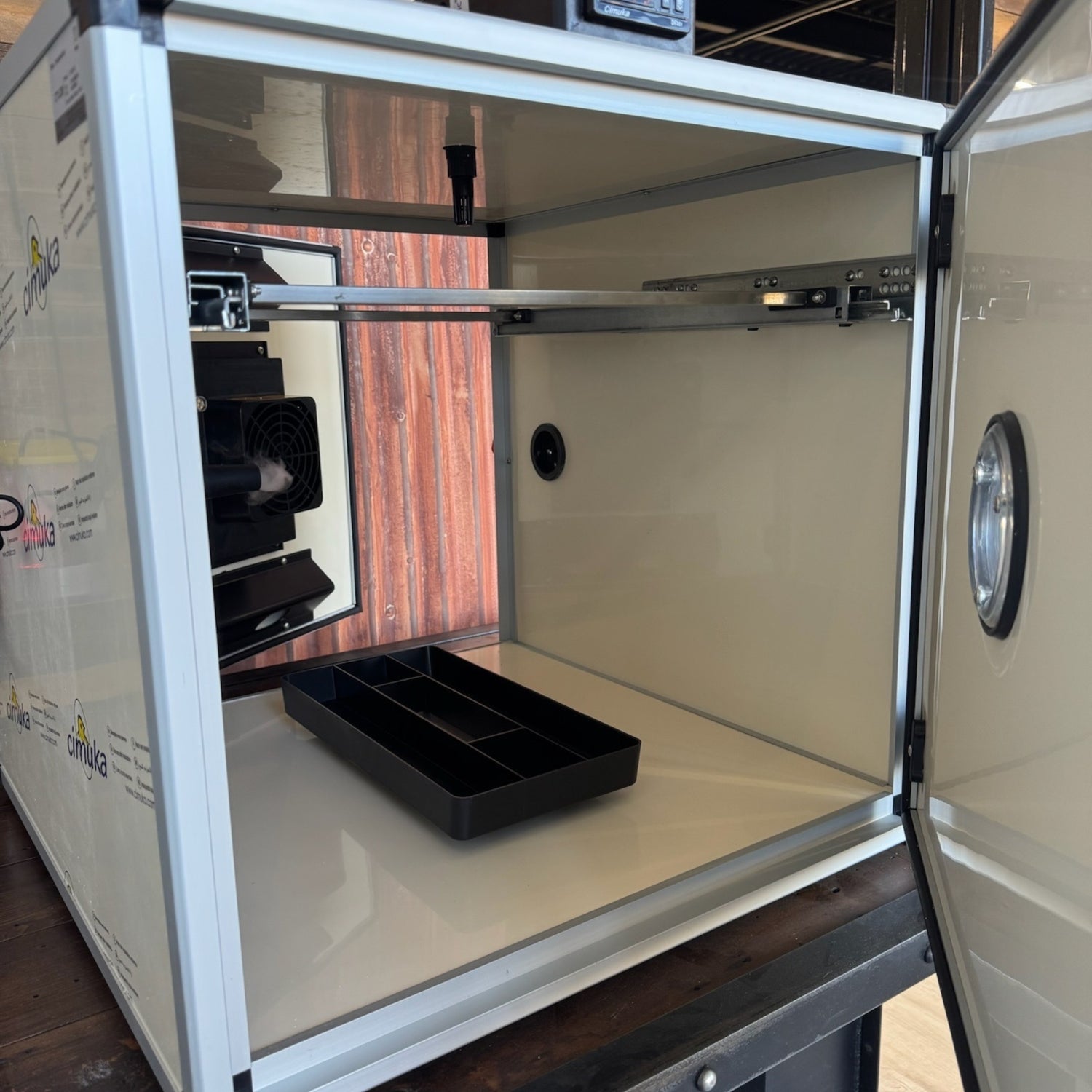 Hatching Time.Close up interior view of queen bee incubator with door open can be seen.