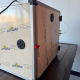 Hatching Time. Queen bee incubator back door can be seen closed with red lock to provide insulated seal.