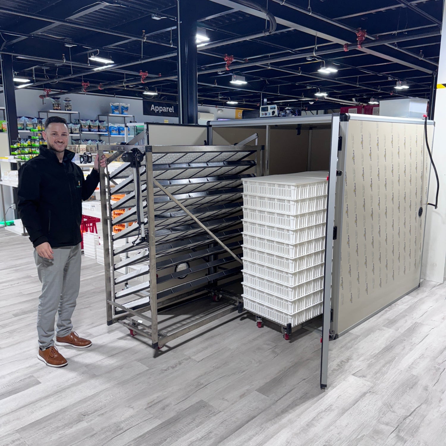 Hatching Time. T series incubator with doors open and setting tray and hatching basket trolly's can be seen in warehouse.