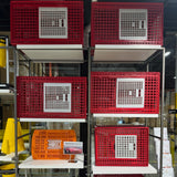 Hatching Time. Transport crates assembled on warehouse shelves.