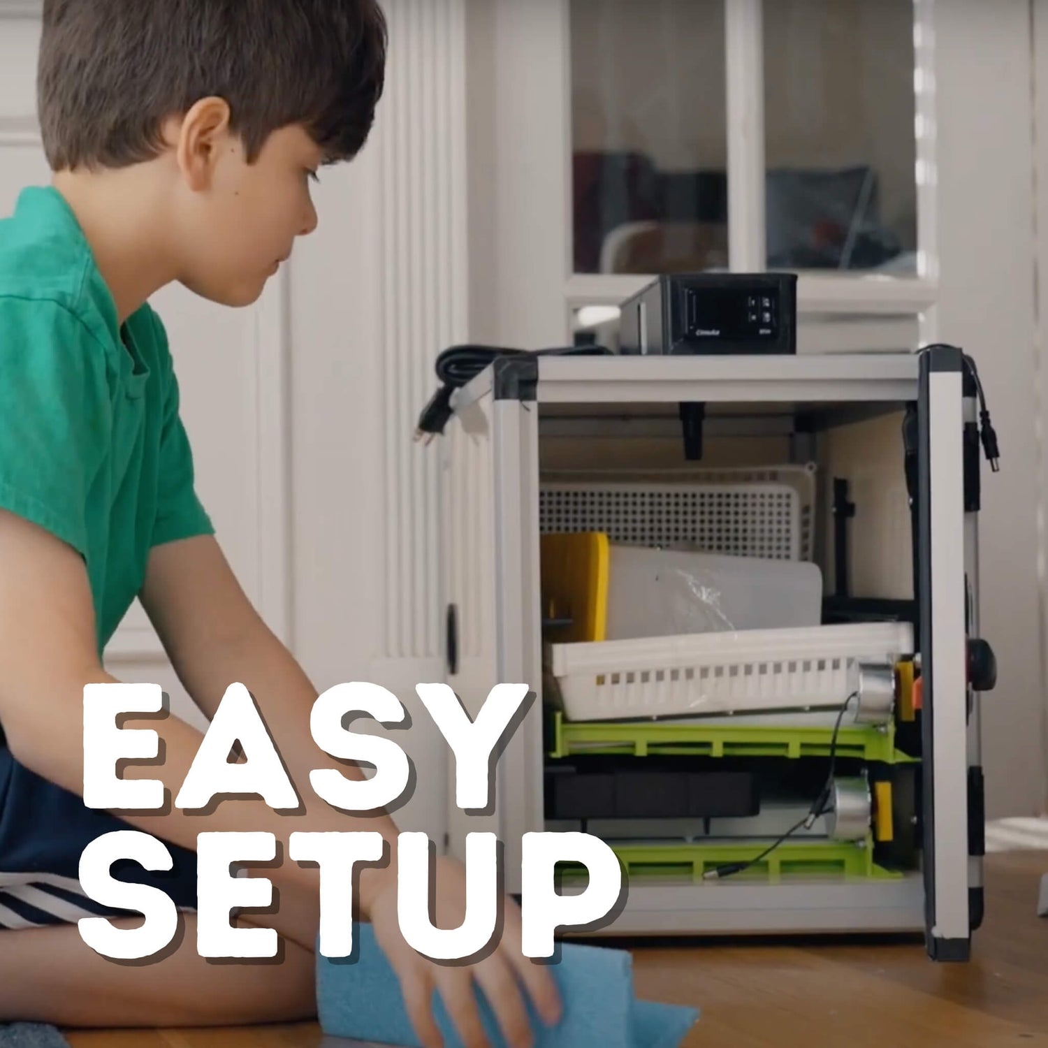 Child next to CT60SH egg incubator showing size of unit and how easy it is to setup