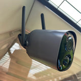 Outdoor Hatching Time Coop Cam camera mounted on a wall with a clear sky background