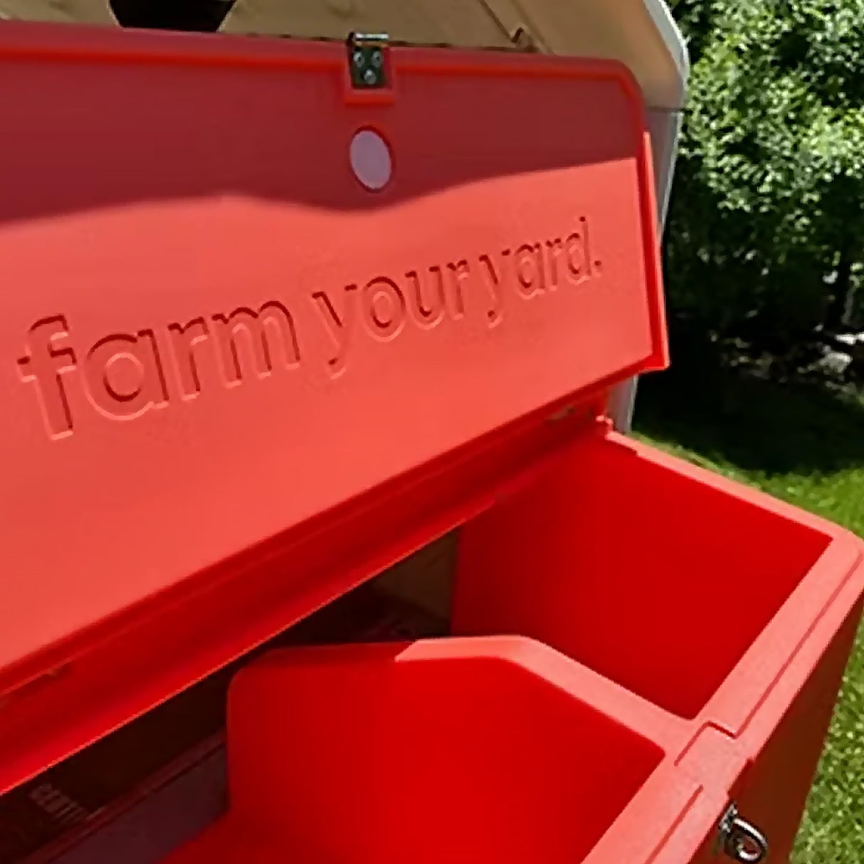 Hatching Time Smart Coop with 'farm your yard' text on a grassy background