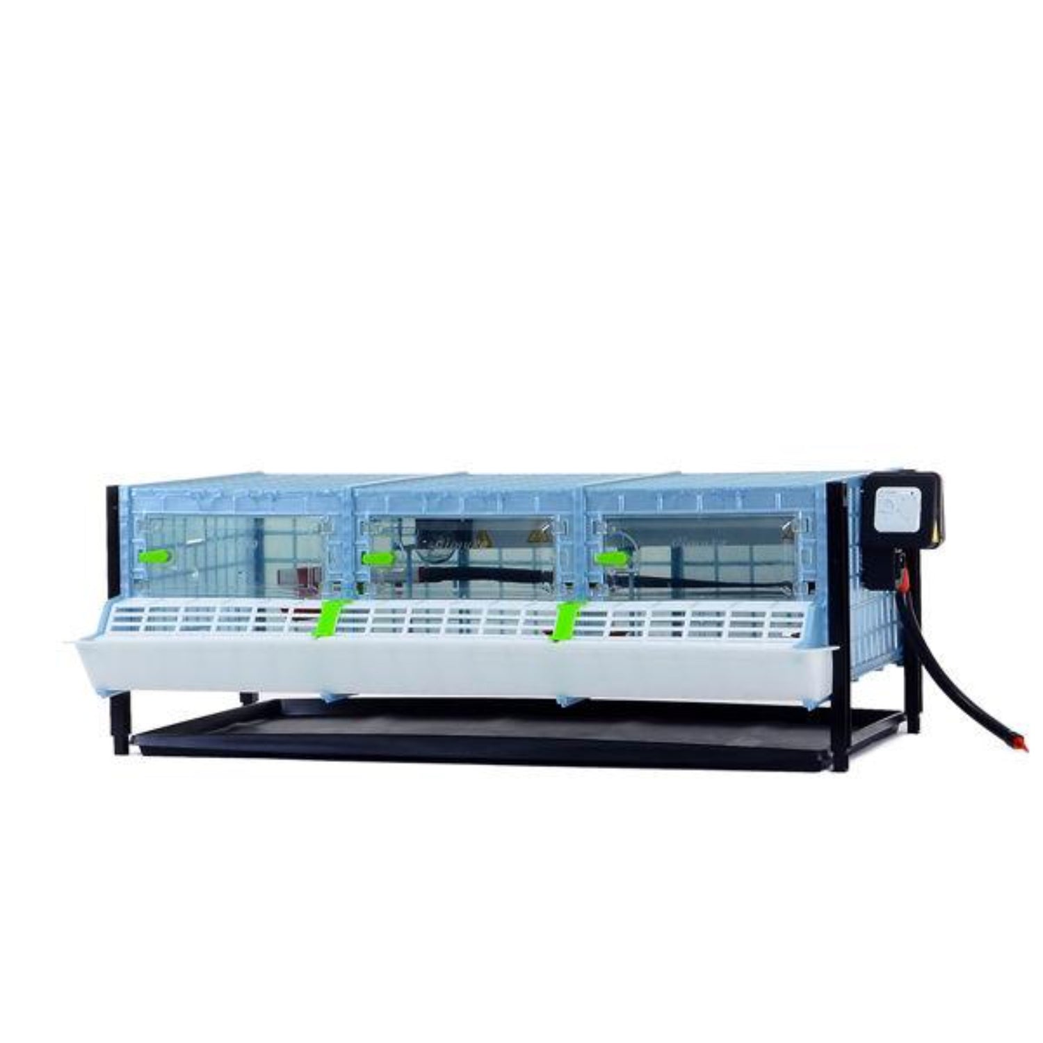 Hatching Time Cimuka Layer addition for brooder system shown. Plastic clear doors are closed. Feeding trough can be seen on front of brooder. Temperature thermostat can be seen on side of brooder.