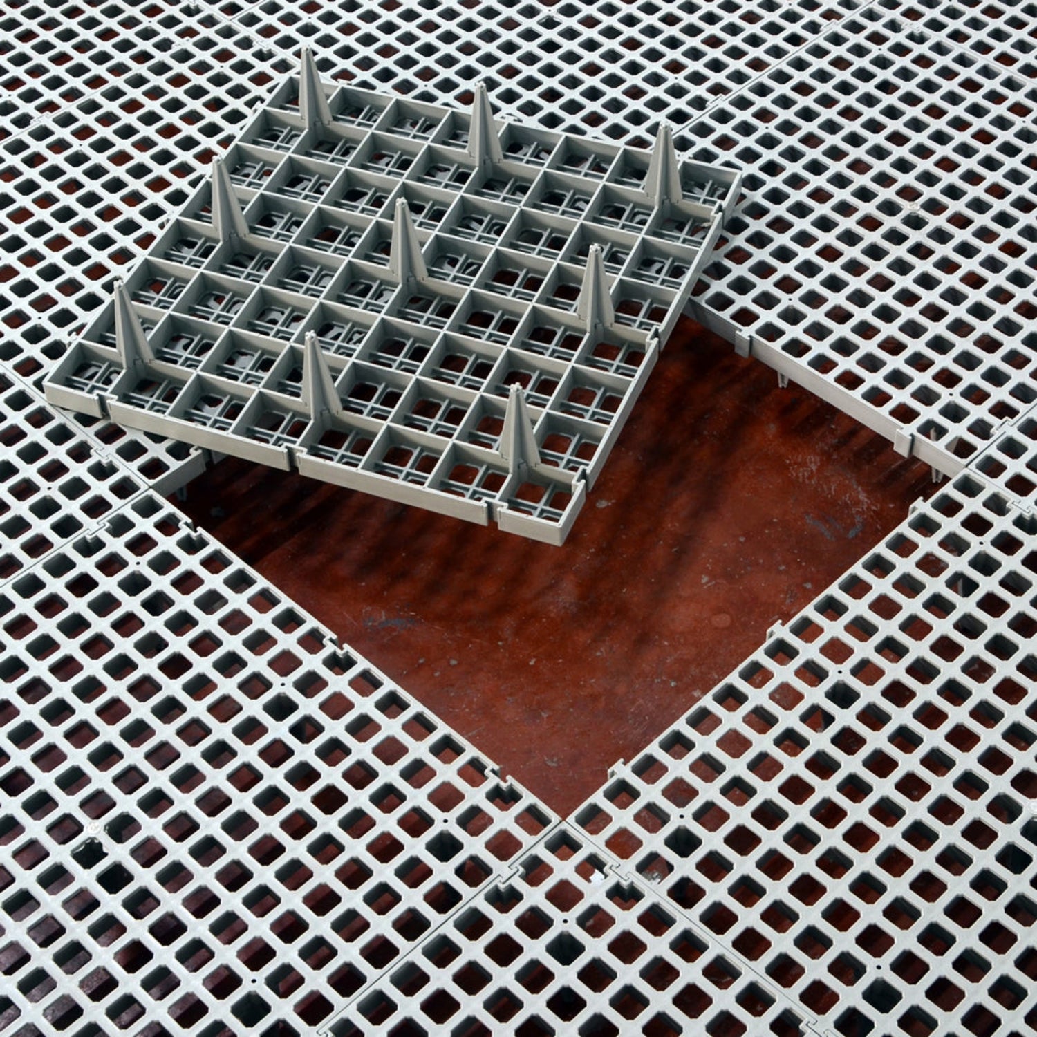 Hatching Time Cimuka. Large Hole slat flooring can be seen with an open space and upturned slat flooring piece in middle.