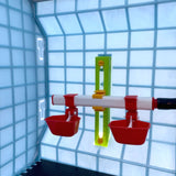 Hatching Time Cimuka Adjustable Wall mounted drinker setup shown inside of Brooder. Chick floor mat visible.