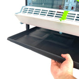 Hatching Time Cimuka 9.5 inch manure tray can be seen being removed from bottom of brooder. Feeder Trough can also be seen in front of clear plastic doors of brooder.