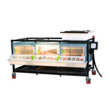 Light on inside Chick Brooder 1 layer 9.5 inch - Cimuka - Hatching Time.  Chick brooder shown with water tank visible on top to provide algae free water through drinker system. Feeding trough and locking doors can be seen on front. Brooder system is on a metal frame on wheels for easy mobility.