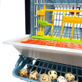 Hatching Time Cimuka Quail Cage full feeding trough shown above roll-out egg tray with quail eggs. Front of quail cage door can also be seen.