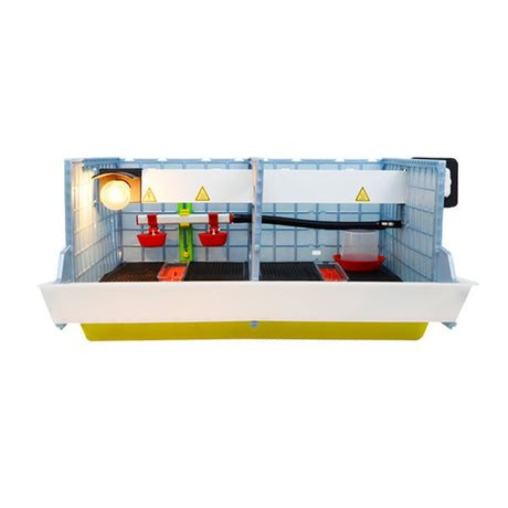 Front Open View - CB25 2 Section 9.5 inch Chick Brooder - Cimuka - Hatching Time. Interior shows lightbulb on, 2 starter feeders, 1 starter drinker and 2 wall mounted drinker cups. Feeding trough visible on front of brooder. Chick floor mat on floor of brooder can be seen.