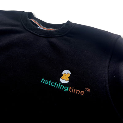 HatchingTime Crewneck Sweatshirt Black Front Logo Closeup